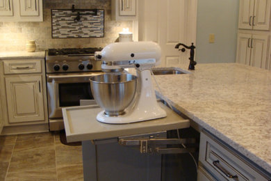 Example of a transitional ceramic tile kitchen design in Other with an undermount sink, solid surface countertops, subway tile backsplash and stainless steel appliances