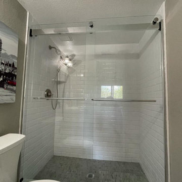 Sliding frameless glass shower door installation