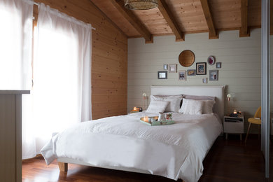 Design ideas for a mid-sized country master bedroom in Other with green walls and dark hardwood floors.