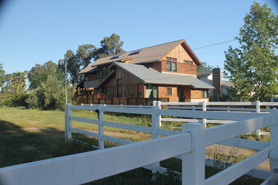 Example of a large trendy two-story mixed siding gable roof design in San Francisco