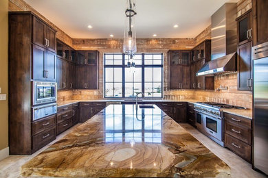 Kitchen pantry - large rustic u-shaped travertine floor kitchen pantry idea in Austin with an undermount sink, shaker cabinets, medium tone wood cabinets, granite countertops, brown backsplash, porcelain backsplash, stainless steel appliances and an island