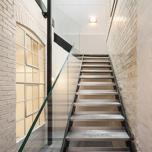 Design ideas for an industrial metal straight staircase in London with open risers.