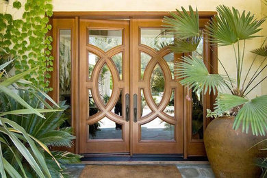 Inspiration for a mid-sized transitional entryway remodel in San Diego with a light wood front door