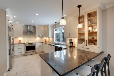 Contemporary white kitchen with black handles