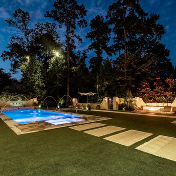 Rectangular pool, covered patio and kitchen, outdoor shower, landscaping