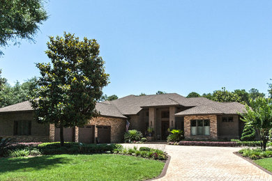 Example of a large trendy brown one-story mixed siding exterior home design in Miami