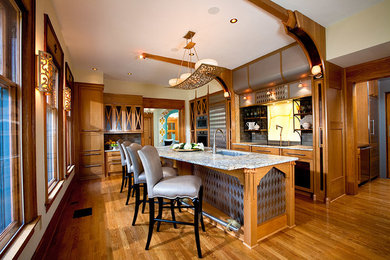 Inspiration for a huge victorian single-wall light wood floor kitchen pantry remodel in Columbus with an undermount sink, recessed-panel cabinets, light wood cabinets, granite countertops, gray backsplash, stone tile backsplash, stainless steel appliances and an island