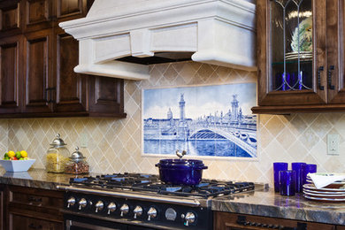 Eat-in kitchen - mid-sized farmhouse u-shaped dark wood floor eat-in kitchen idea in San Francisco with a farmhouse sink, beaded inset cabinets, dark wood cabinets, granite countertops, blue backsplash, stone tile backsplash and paneled appliances