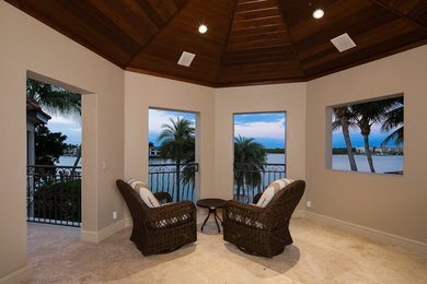 Example of a mid-sized tuscan backyard patio design in Miami