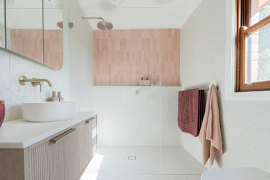 Design ideas for a small modern master bathroom in Sydney with flat-panel cabinets, light wood cabinets, an open shower, a two-piece toilet, multi-coloured tile, a vessel sink, multi-coloured floor, an open shower, white benchtops, a single vanity and a floating vanity.