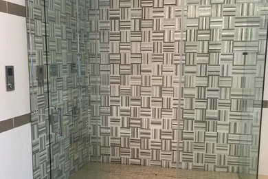 Example of a huge trendy master glass tile porcelain tile and gray floor double shower design in Miami with flat-panel cabinets, white cabinets, white walls, quartzite countertops and a hinged shower door
