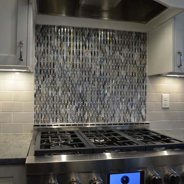 Kitchen With Large Center Island and Separate Cooking Area
