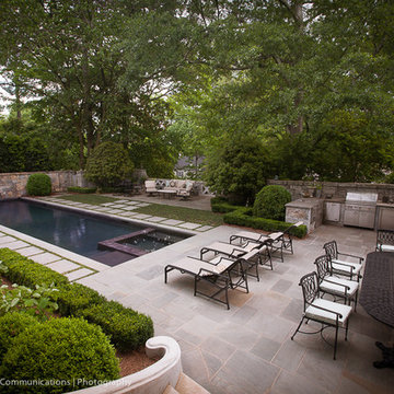 Peachtree battle lap pool with submerged spa and water feature