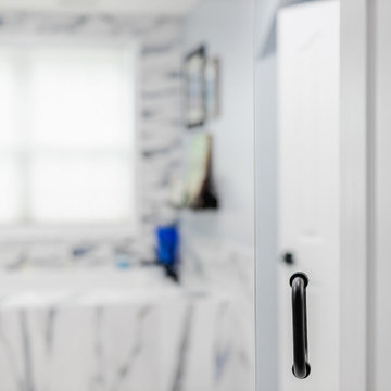 Bathroom remodeling in Columbia, MD with double vanity & marble bathtub