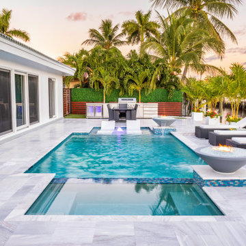 Custom Pool & Spa With Water and Fire Bowls in Pompano Beach