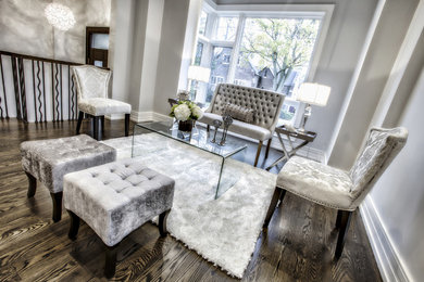 Inspiration for a mid-sized contemporary formal and open concept dark wood floor and brown floor living room remodel in Toronto with gray walls, no fireplace and no tv