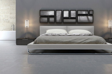 Mid-sized urban master light wood floor and gray floor bedroom photo in New York with beige walls