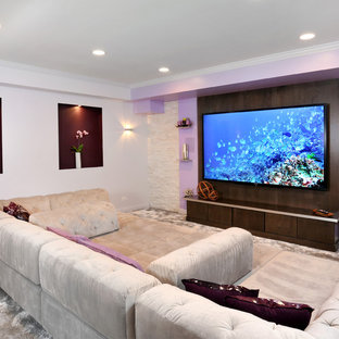 This is an example of a large modern fully buried basement in Chicago with purple walls, carpet and no fireplace.