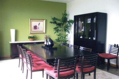 Enclosed dining room - mid-sized contemporary ceramic tile enclosed dining room idea in Miami with green walls and no fireplace