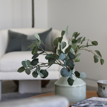 Eucalyptus Leaves in Jar with White Boucle Chair