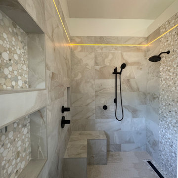 Curd-less walk-in shower; heated floors in bathroom + shower+bench LED