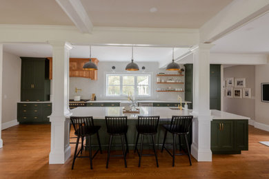 Eat-in kitchen - huge transitional galley medium tone wood floor, brown floor and coffered ceiling eat-in kitchen idea in Boston with a farmhouse sink, shaker cabinets, green cabinets, quartz countertops, white backsplash, ceramic backsplash, stainless steel appliances, an island and white countertops
