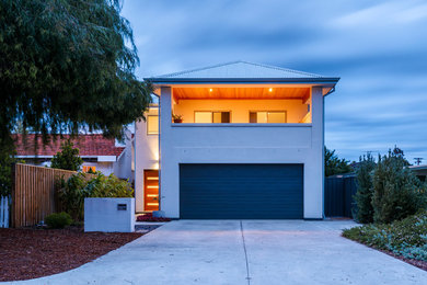 This is an example of a large contemporary two-storey white exterior in Perth.