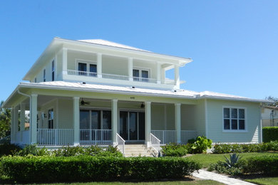 Example of a beach style home design design in Miami