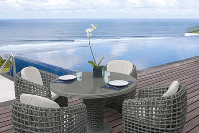Inspiration for a large contemporary backyard rectangular infinity pool remodel in Miami with decking