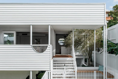 Design ideas for a beach style home design in Brisbane.