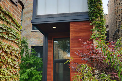 This is an example of a contemporary brown exterior in Chicago.