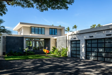 Inspiration for a modern multicolored two-story stucco exterior home remodel in Hawaii