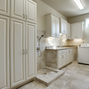 This is an example of a mediterranean utility room in Austin with white walls, ceramic flooring, a side by side washer and dryer and a submerged sink.