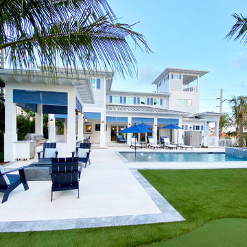 Resort Style Coastal Backyard with Pool and Outdoor Living
