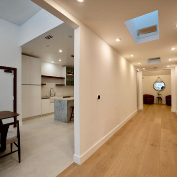 Hall With Skylight Beside Open Kitchen