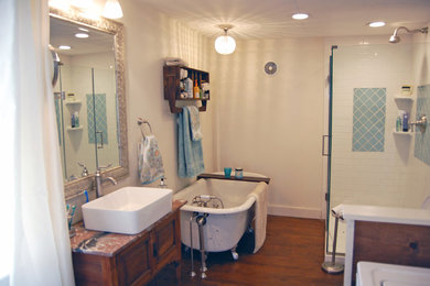 Example of a transitional white tile and subway tile medium tone wood floor bathroom design in Bridgeport with a two-piece toilet, white walls and a vessel sink