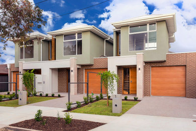 Photo of a contemporary two-storey townhouse exterior in Adelaide.