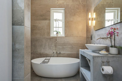 Freestanding bathtub - small contemporary 3/4 gray tile and cement tile concrete floor freestanding bathtub idea in Other with concrete countertops