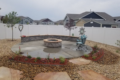 Circular Patio with Firepit and Surrounding Landscapde