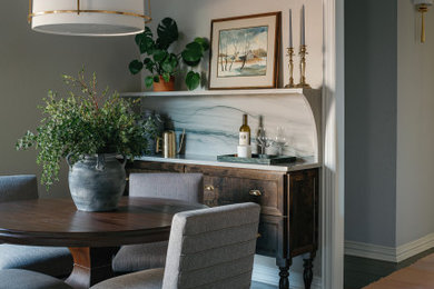 Inspiration for a transitional dark wood floor and brown floor dining room remodel in Dallas with gray walls