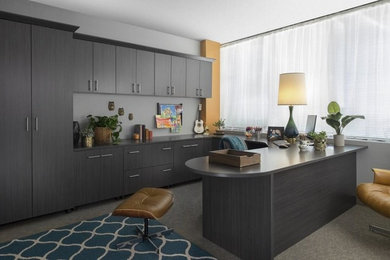 Large transitional built-in desk carpeted and gray floor study room photo in Philadelphia with gray walls