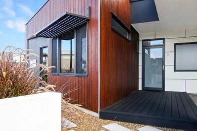 Photo of a mid-sized modern entryway in Sunshine Coast.