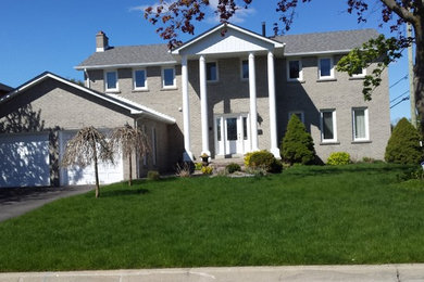 This is an example of a traditional two-storey white exterior in Toronto.