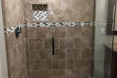 Inspiration for a small brown tile corner shower remodel in Salt Lake City