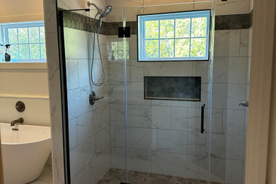 Inspiration for a small contemporary master ceramic tile, white floor and double-sink bathroom remodel in Other with recessed-panel cabinets, brown cabinets, a two-piece toilet, white walls, an undermount sink, granite countertops, a hinged shower door, beige countertops and a built-in vanity