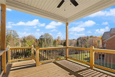 Deck - mid-sized modern backyard second story wood railing deck idea in Philadelphia with a roof extension