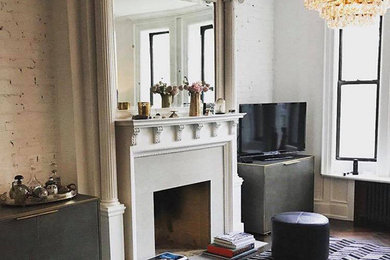 Mid-sized mid-century modern formal and open concept dark wood floor and black floor living room photo in New York with white walls, a standard fireplace, a brick fireplace and a tv stand
