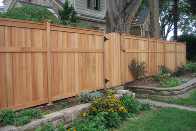 Inspiration for a mid-sized farmhouse backyard landscaping in Minneapolis.
