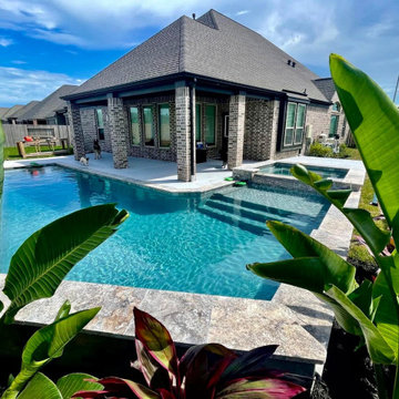 Pool and Raised Spa Framed by Tropical Planting