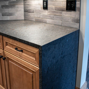 Reconfigured kitchen with new islands, countertops, backsplash